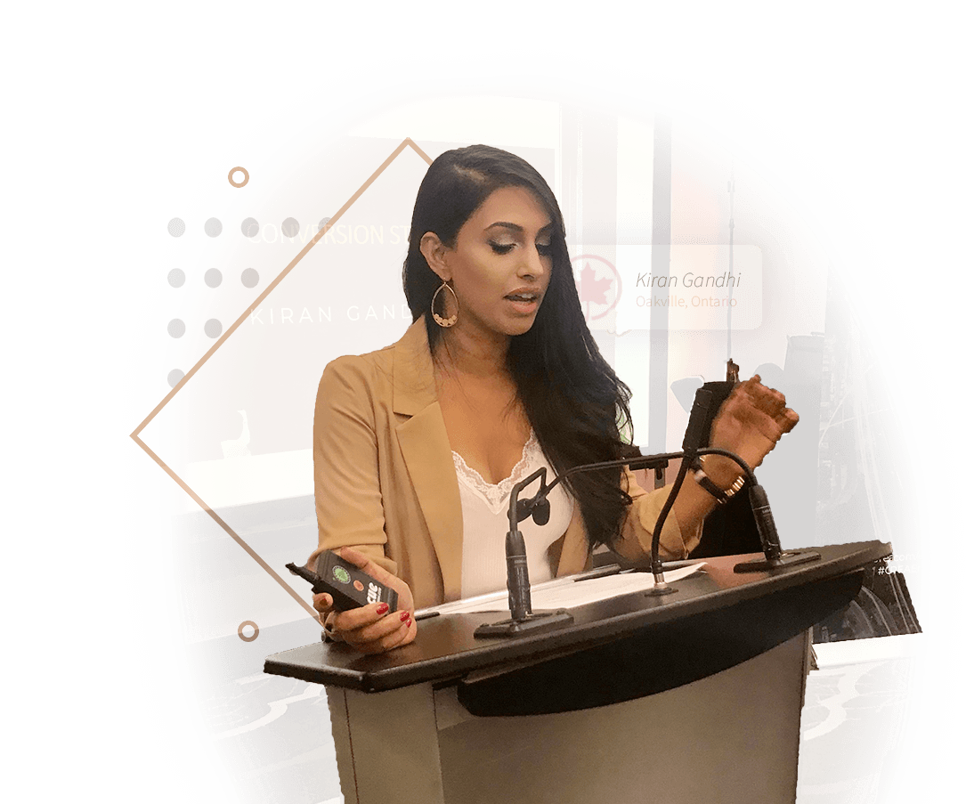 Kiran Gandhi speaking at a podium